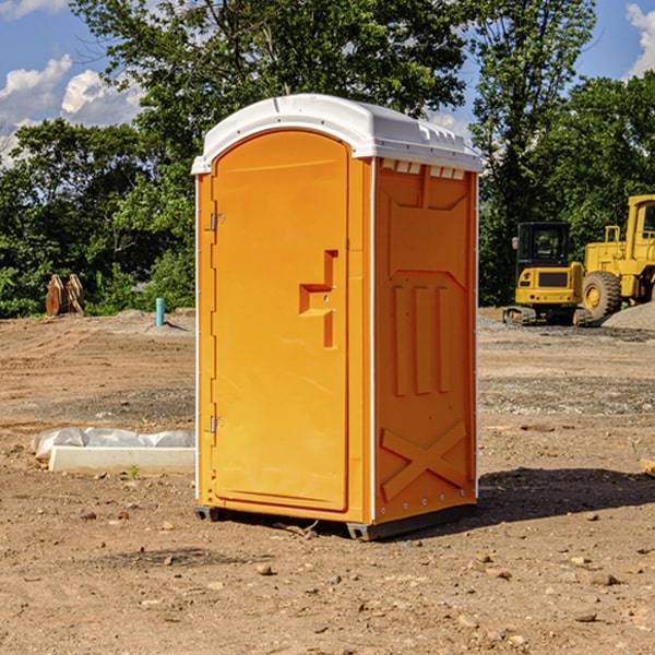 what is the cost difference between standard and deluxe portable restroom rentals in Caledonia